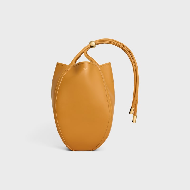 SMALL DROP BUCKET IN SUPPLE SMOOTH CALFSKIN - MARIGOLD - CROSS-BODY BAGS - 1 | CELINE