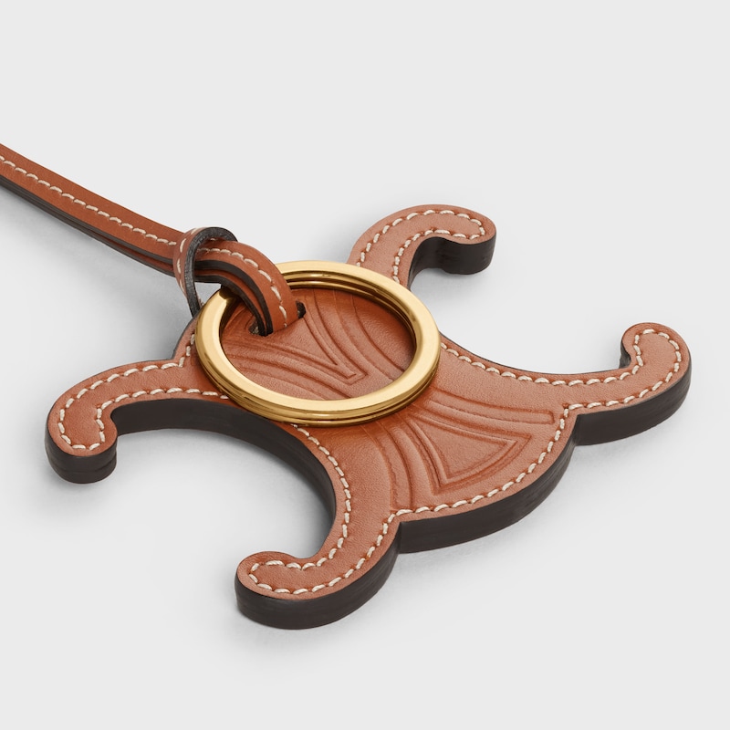 TRIOMPHE CHARM IN SMOOTH CALFSKIN - TAN - CHARMS AND ACCESSORIES - 1 | CELINE