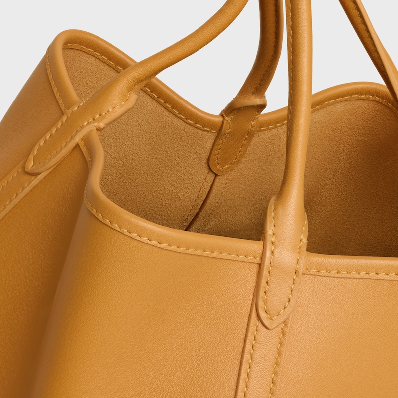 SMALL DROP BUCKET IN SUPPLE SMOOTH CALFSKIN - MARIGOLD - CROSS-BODY BAGS - 1 | CELINE