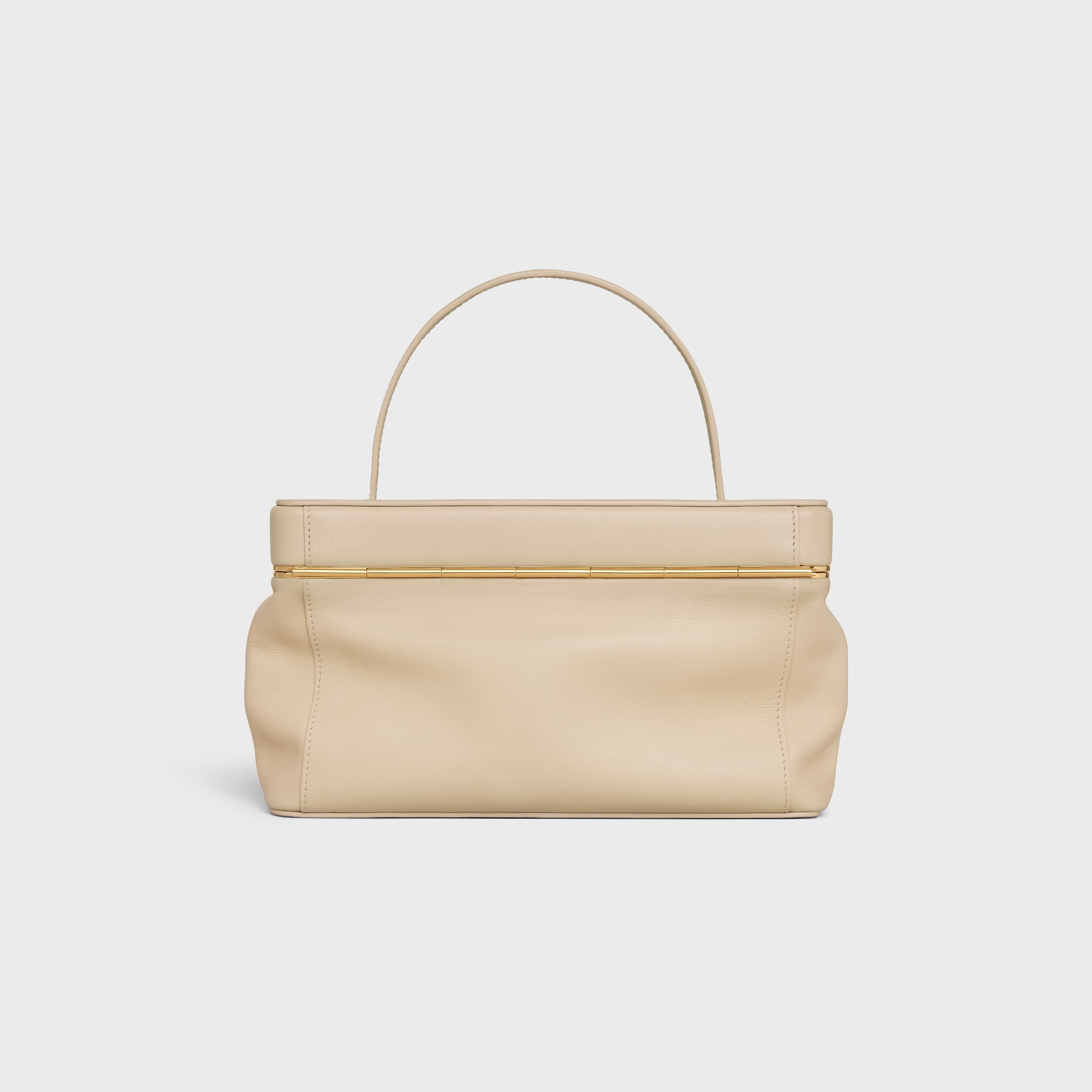 EAST WEST TRIOMPHE FRAME IN SUPPLE CALFSKIN - DEEP IVORY | CELINE