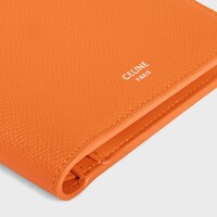 Bi-fold Wallet with Coin Compartment IN GRAINED CALFSKIN - FLUO ORANGE - ESSENTIALS - 1 | CELINE
