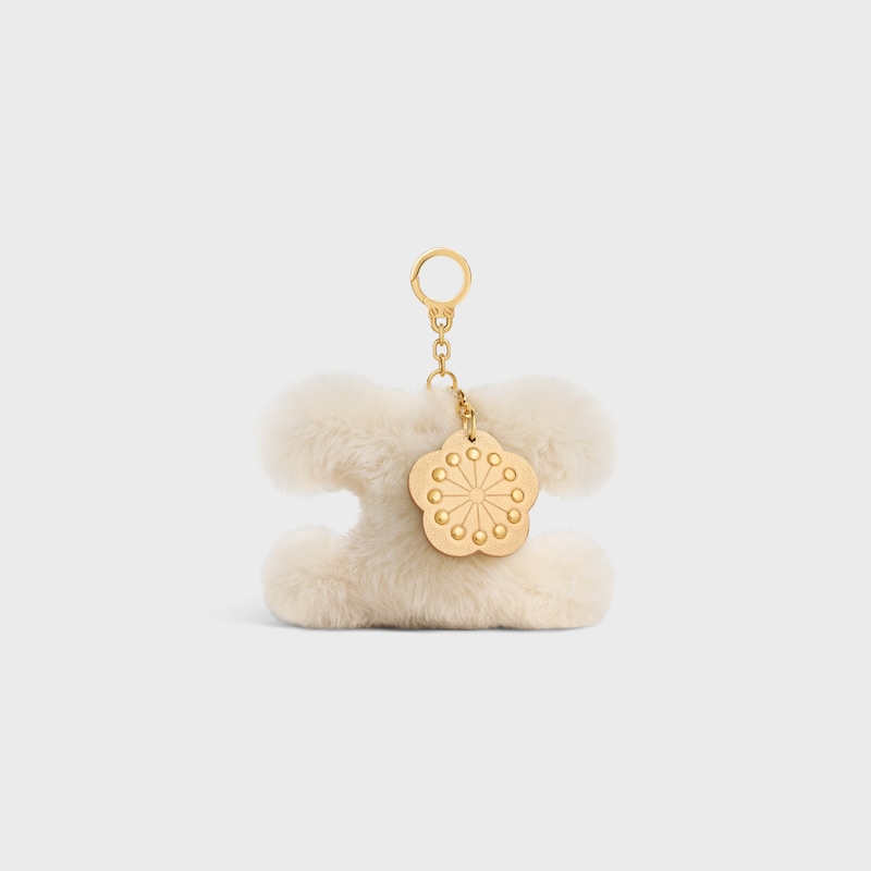 TRIOMPHE POM POM CHARM WITH PLUM FLOWER IN SHEARLING AND CALFSKIN - RICE - BAG CHARMS - 1 | CELINE