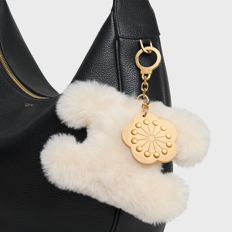 TRIOMPHE POM POM CHARM WITH PLUM FLOWER IN SHEARLING AND CALFSKIN - RICE - BAG CHARMS - 1 | CELINE