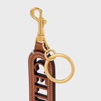 PERFORATED KEYRING CHARM CELINE IN SMOOTH CALFSKIN - TAN - BAG CHARMS - 1 | CELINE