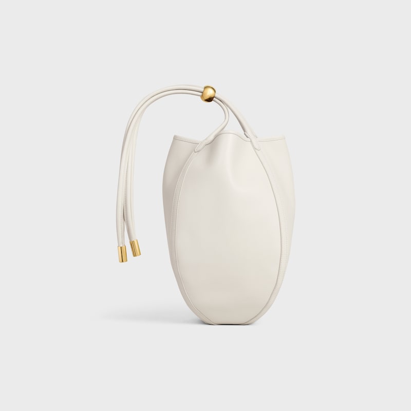 SMALL DROP BUCKET IN SUPPLE SMOOTH CALFSKIN - WHITE COTTON - CROSS-BODY BAGS - 1 | CELINE