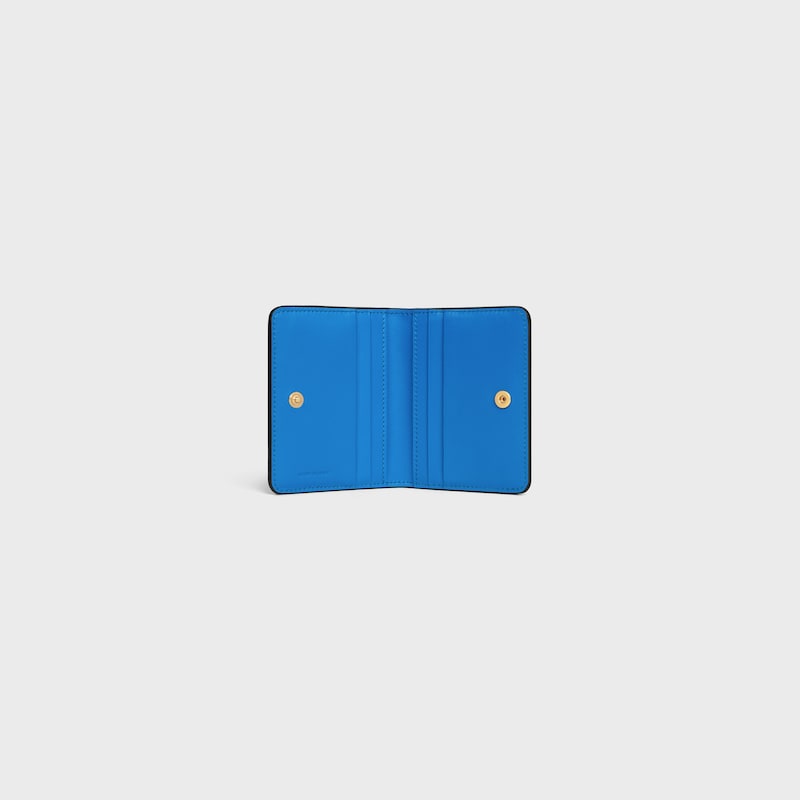 BI-FOLD CARD HOLDER TRIOMPHE STAMP IN SUPPLE GRAINED CALFSKIN - BLACK / ULTRA BLUE - COIN AND CARD HOLDERS - 1 | CELINE