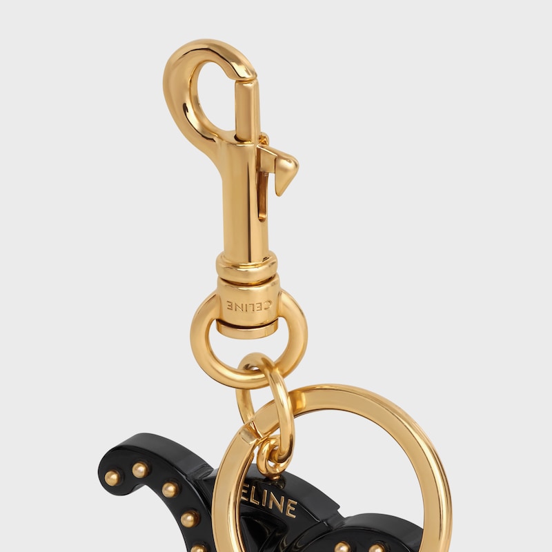 TRIOMPHE KEYRING CHARM in PLEXIGLASS with GOLD FINISHING - BLACK - BAG CHARMS - 1 | CELINE