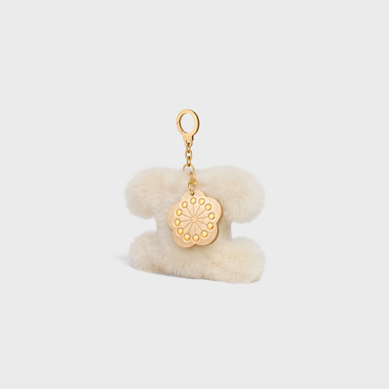 TRIOMPHE POM POM CHARM WITH PLUM FLOWER IN SHEARLING AND CALFSKIN - RICE - BAG CHARMS - 1 | CELINE