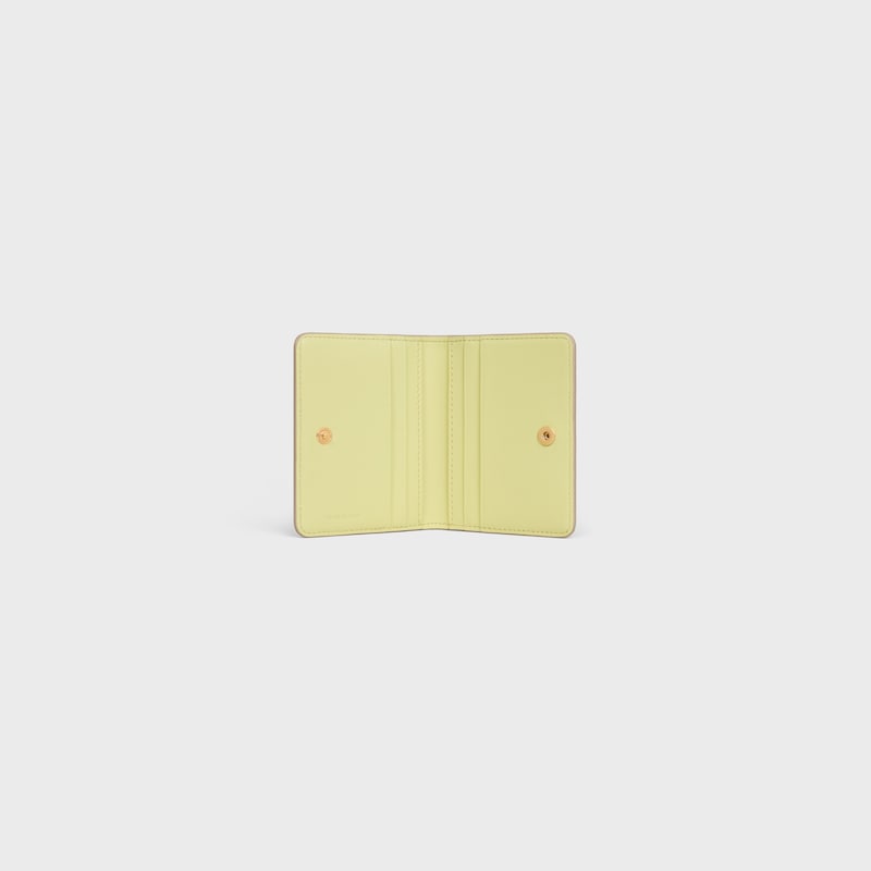 BI-FOLD CARD HOLDER TRIOMPHE STAMP IN SUPPLE GRAINED CALFSKIN - SAFARI / CITRUS - COIN AND CARD HOLDERS - 1 | CELINE