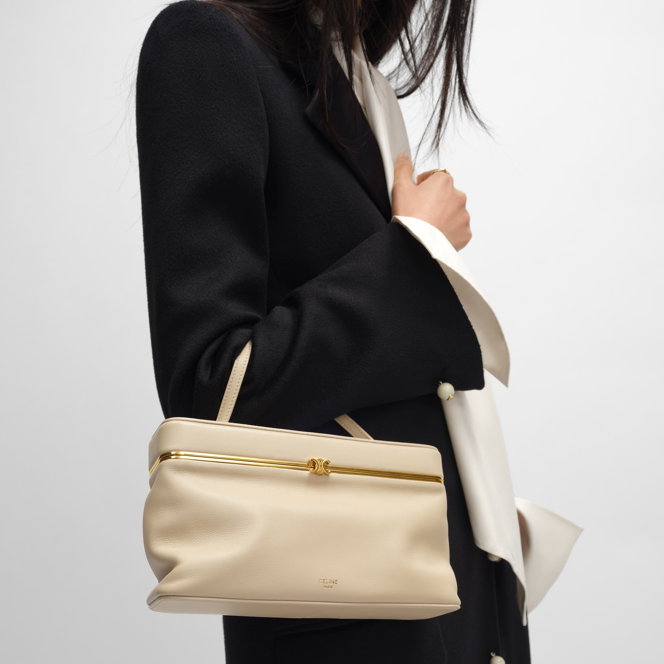 EAST WEST TRIOMPHE FRAME IN SUPPLE CALFSKIN - DEEP IVORY | CELINE