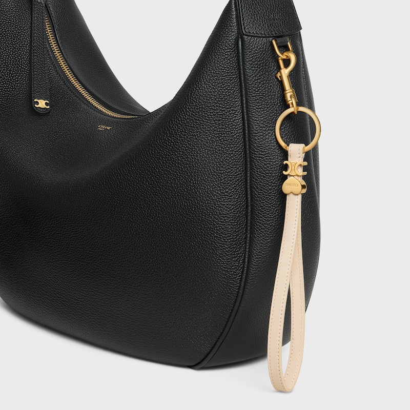 TRIOMPHE CHARM IN SMOOTH CALFSKIN - CREAM - CHARMS AND ACCESSORIES - 1 | CELINE