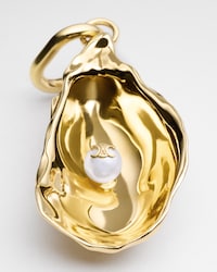 CHARMS OYSTER IN RESIN PEARL AND BRASS WITH GOLD FINISH - GOLD / IVORY - CHARMS - 1 | CELINE