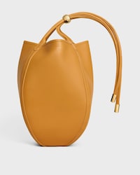 SMALL DROP BUCKET IN SUPPLE SMOOTH CALFSKIN - MARIGOLD - BUCKET - 1 | CELINE