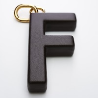 ALPHABET CHARMS F LETTER IN LAMBSKIN  AND BRASS WITH GOLD FINISH - CHATAIGNE - CHARMS - 1 | CELINE
