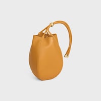 SMALL DROP BUCKET IN SUPPLE SMOOTH CALFSKIN - MARIGOLD - BUCKET - 2 | CELINE