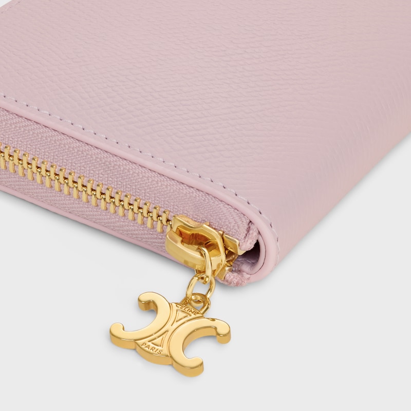 Small Zipped Wallet TRIOMPHE CHARMS IN GRAINED CALFSKIN - BLEACHED PINK - WALLETS - 1 | CELINE