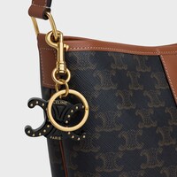 TRIOMPHE KEYRING CHARM in PLEXIGLASS with GOLD FINISHING - BLACK - CHARMS AND ACCESSORIES - 1 | CELINE