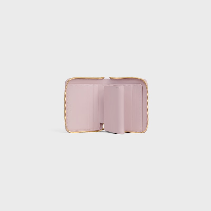 Small Zipped Wallet TRIOMPHE CHARMS IN GRAINED CALFSKIN - BLEACHED PINK - WALLETS - 1 | CELINE